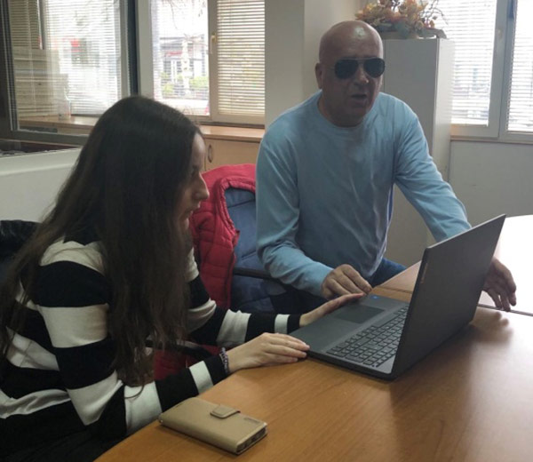 Training participant Martina Stanić applies acquired computer skills with the help of lecturer Hamdo Kentra.